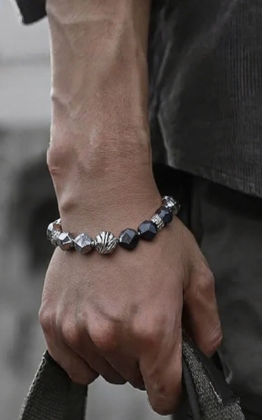 Feng Shui bracelet for men, featuring a combination of black and silver Obsidian beads, designed to bring positive energy and balance. The perfect gift for men that can enhance their well-being and style.